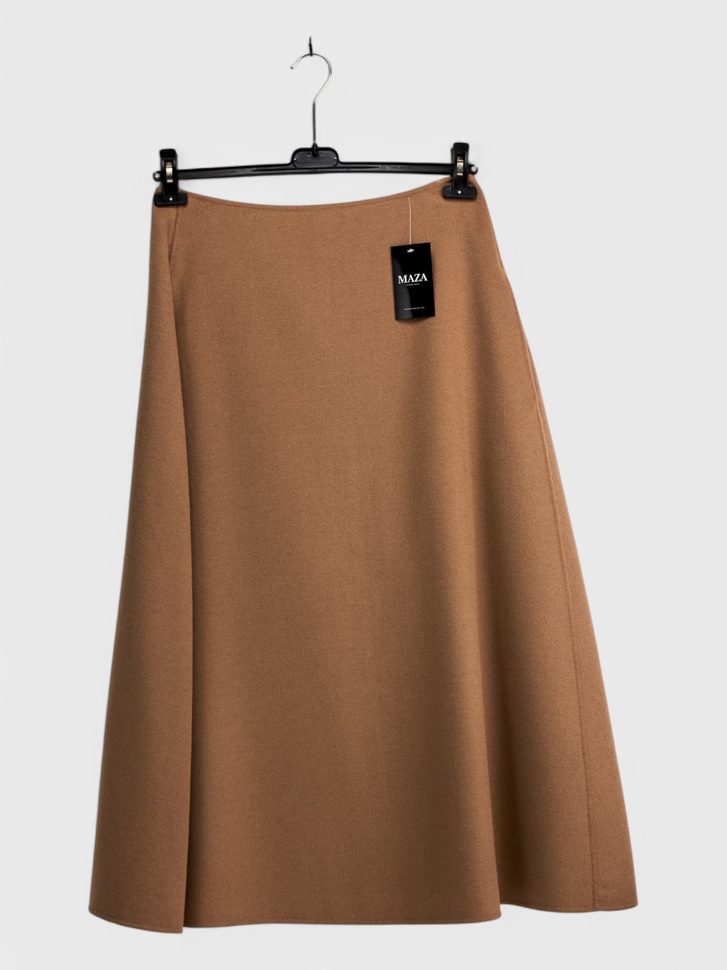 Long camel-colored wool skirt size 48 in an A-line silhouette, displayed on a hanger against a white background with a visible price tag.