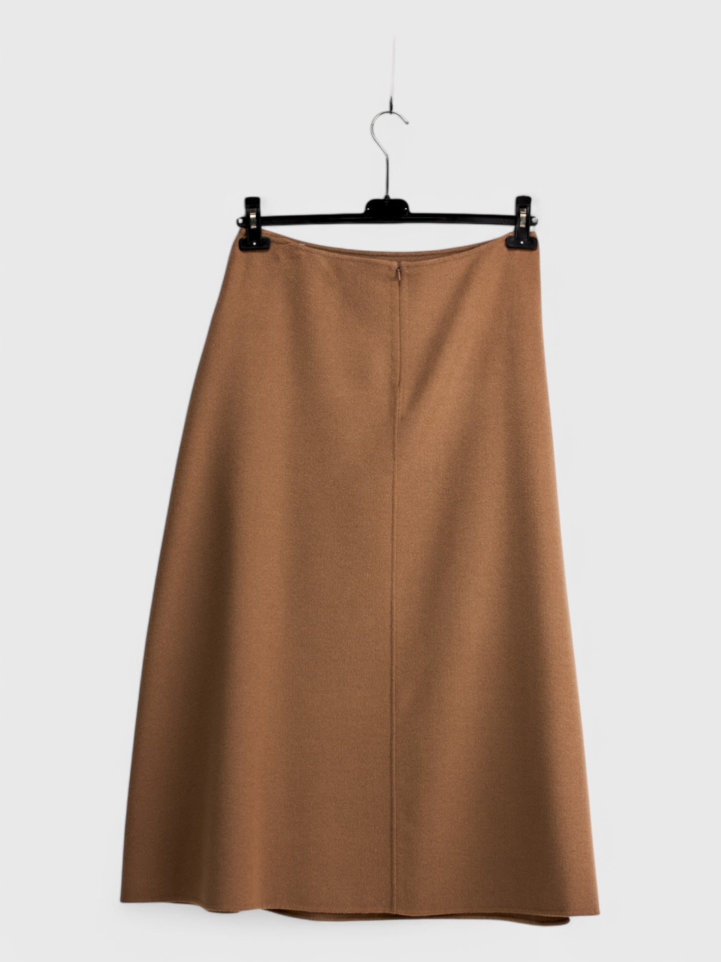 Back view of long camel-colored wool skirt size 48 with center seam and zipper, displayed on a hanger against a white background.